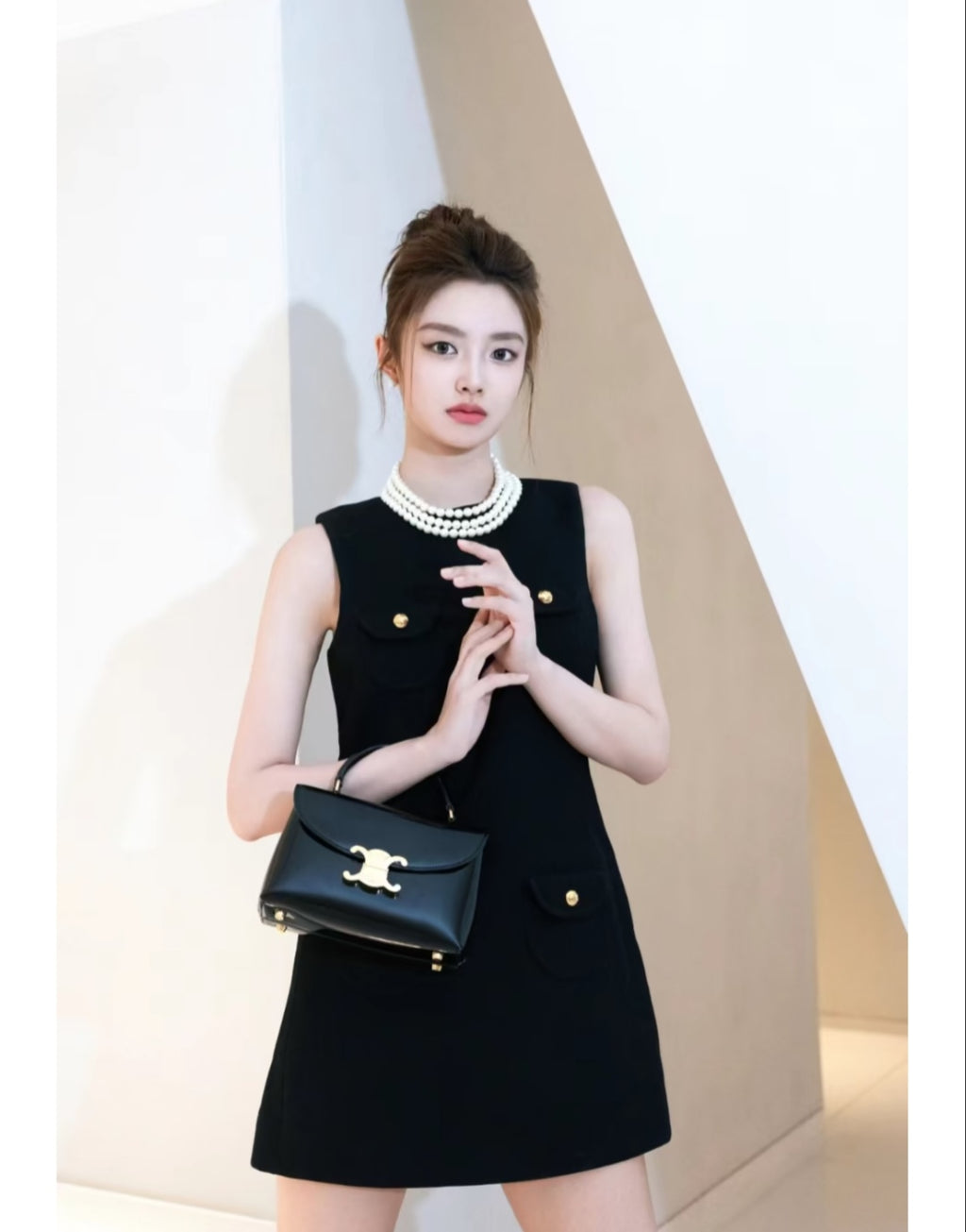 Celine black mini handbag with top handles and gold logo front flap