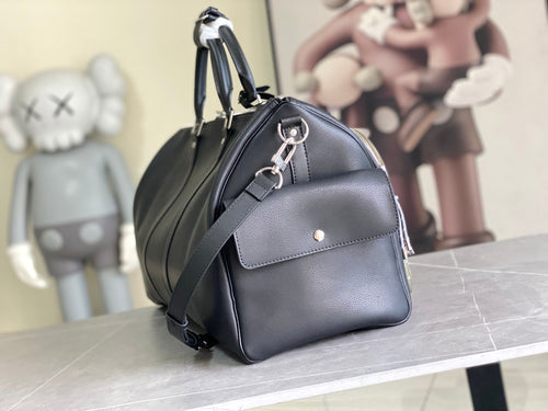 Louis Vuitton men’s leather duffle bag, rounded top handles and adjustable shoulder strap