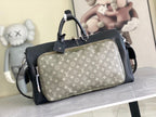 Louis Vuitton men’s duffle bag with dark body and light monogram canvas front panel