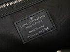 Louis Vuitton bag leather interior label, dark fabric with text