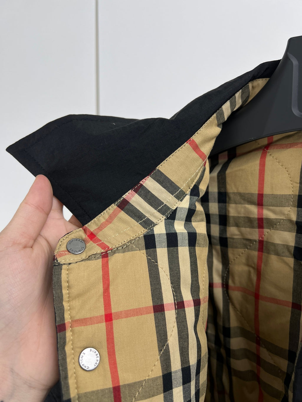 Quilted jacket plaid lining at collar, tan, navy, red and beige panels