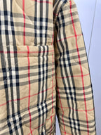 Plaid puffer jacket with front pocket panels and buttoned front