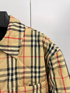 Plaid puffer jacket shoulder and sleeve with quilted panels and button placket