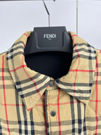 Plaid button-up jacket collar with quilted fabric and metal snap buttons