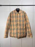Plaid puffer jacket with black collar, button front, long sleeves