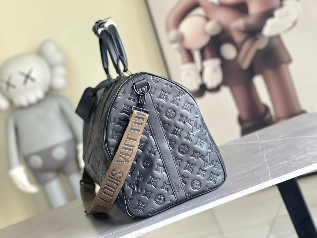 Men’s Louis Vuitton monogram duffel bag with small front pocket and adjustable crossbody strap