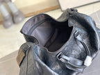Louis Vuitton dark blue monogram duffel with open top and interior zip pocket