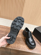 Prada black leather lace-up shoe with textured tread outsole