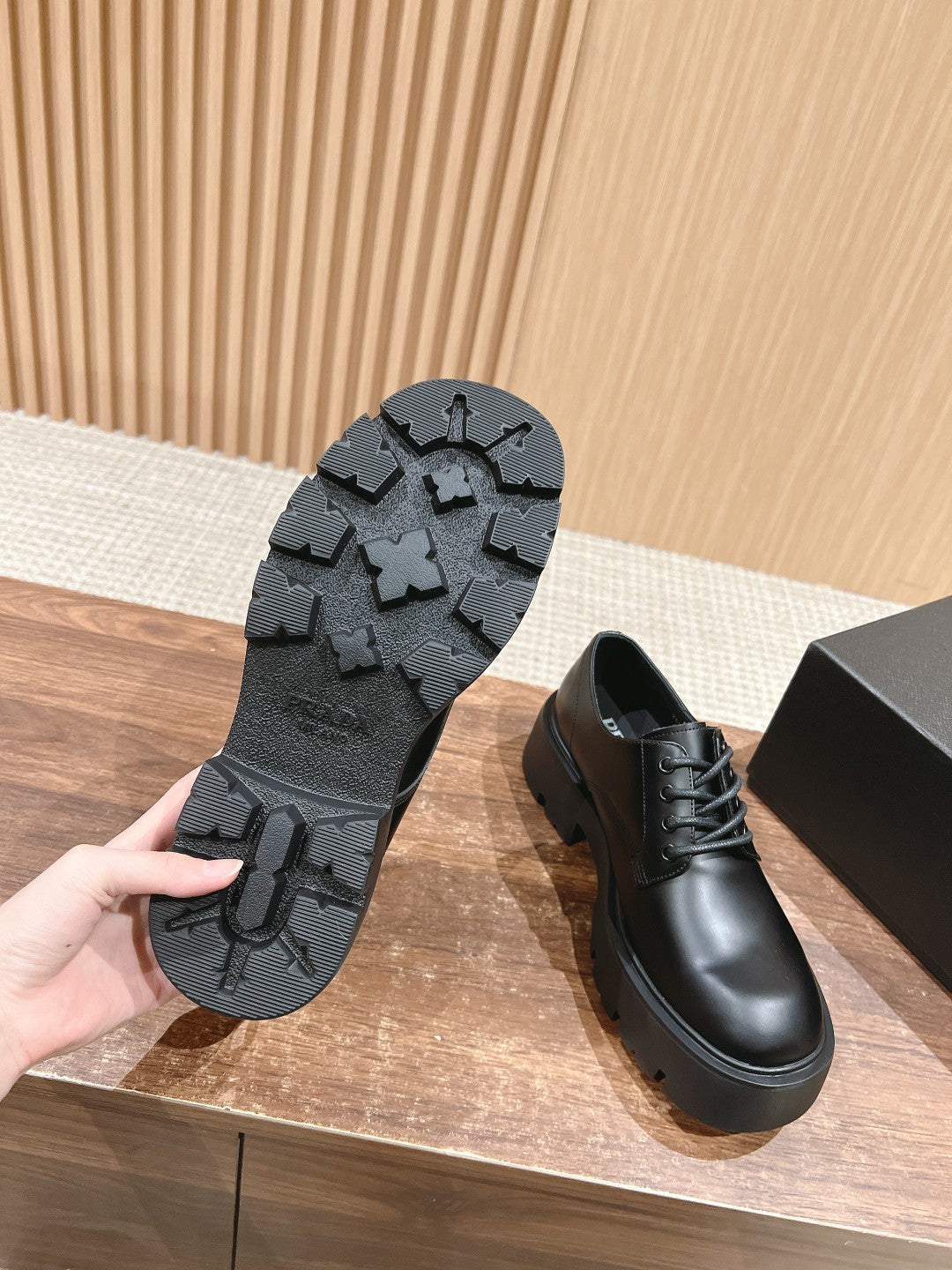Prada black leather lace-up shoe with textured tread outsole