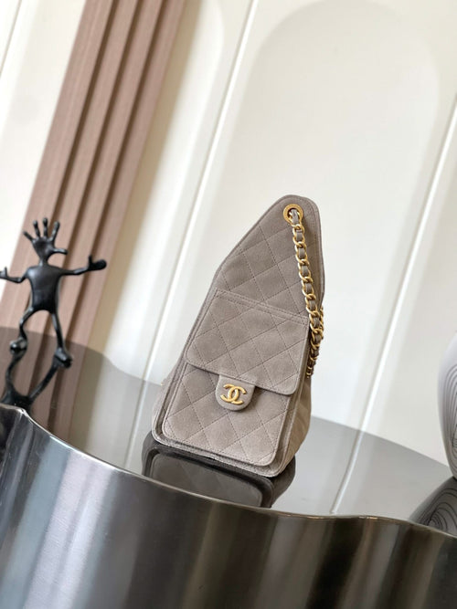 Small quilted flap bag in light gray with gold-tone chain strap and CC logo clasp