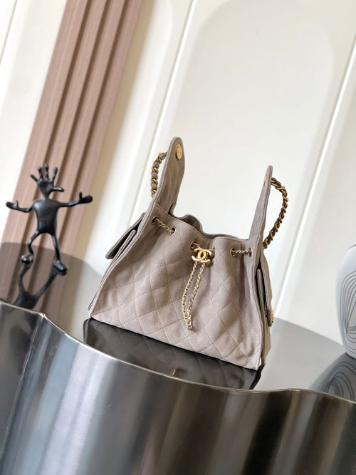 Chanel bag in light gray quilted leather with gold-tone chain strap and top handle