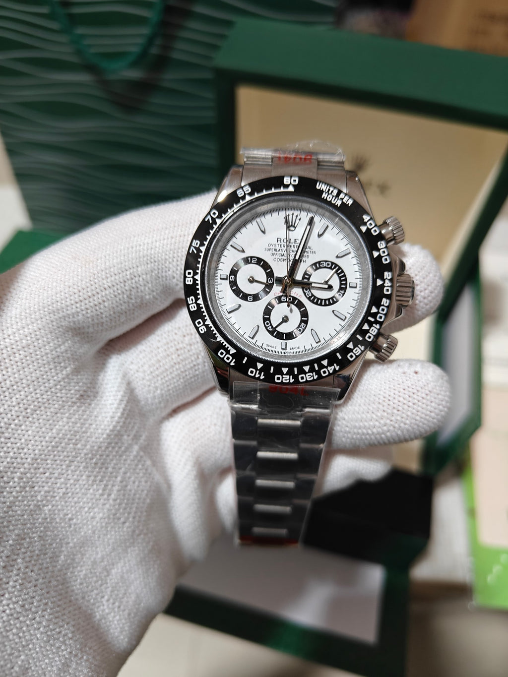 Rolex wrist watch with white dial and metal bracelet