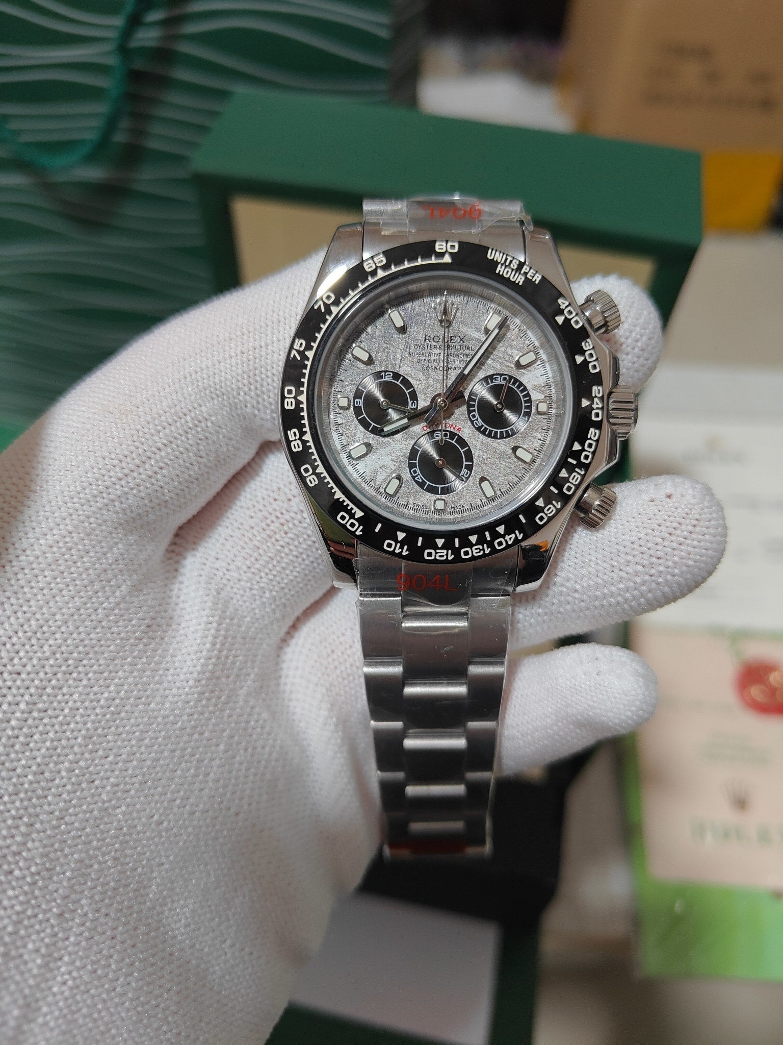 Rolex wrist watch with silver-gray dial and metal bracelet