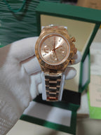 Rolex chronograph watch with gold-tone metal bracelet, rose-gold case, champagne dial and subdials
