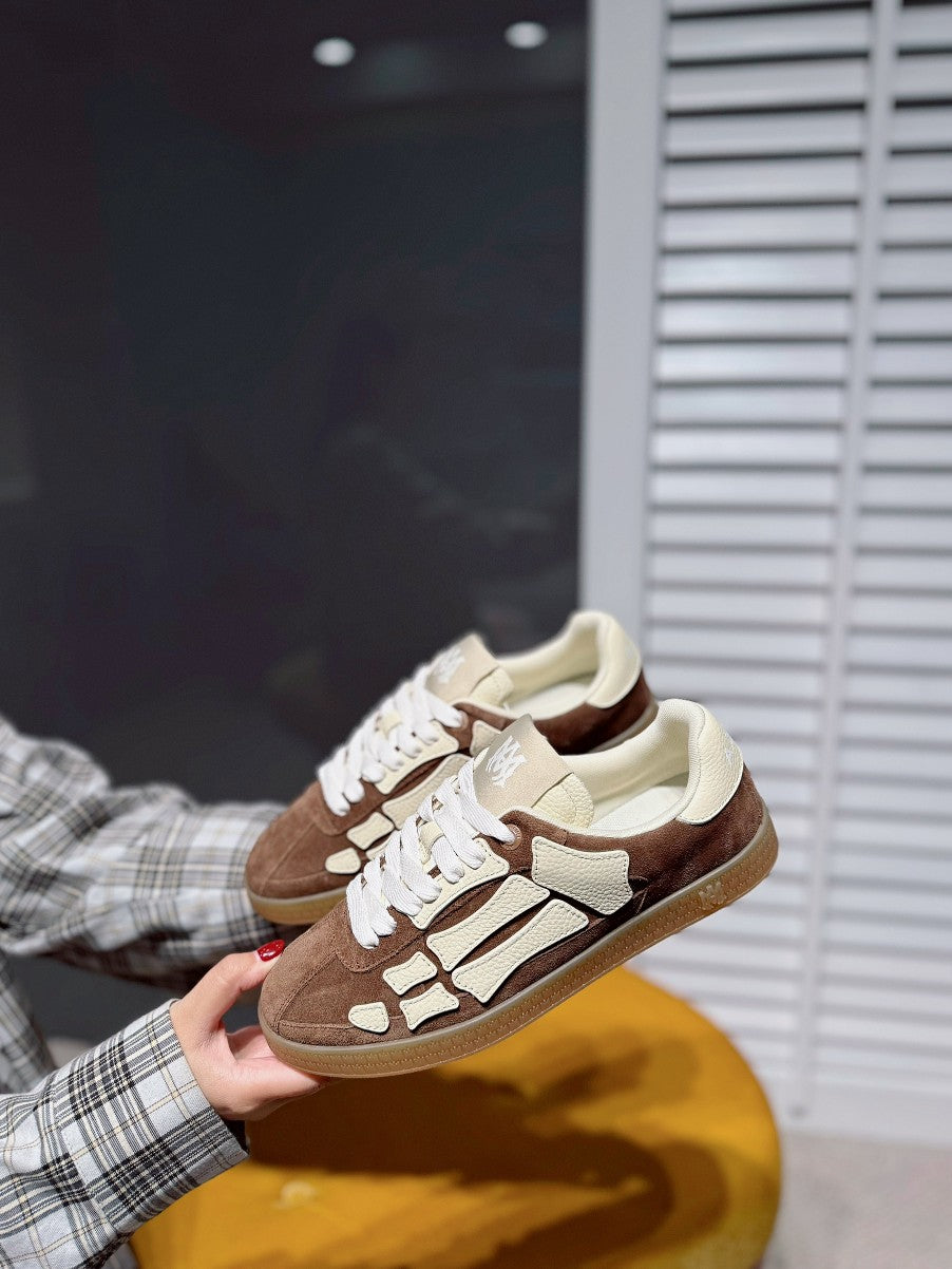 Suede sneakers, brown sole and cream uppers with white laces and logo