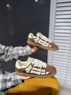 Suede sneakers, brown and cream with white laces and logo patch design