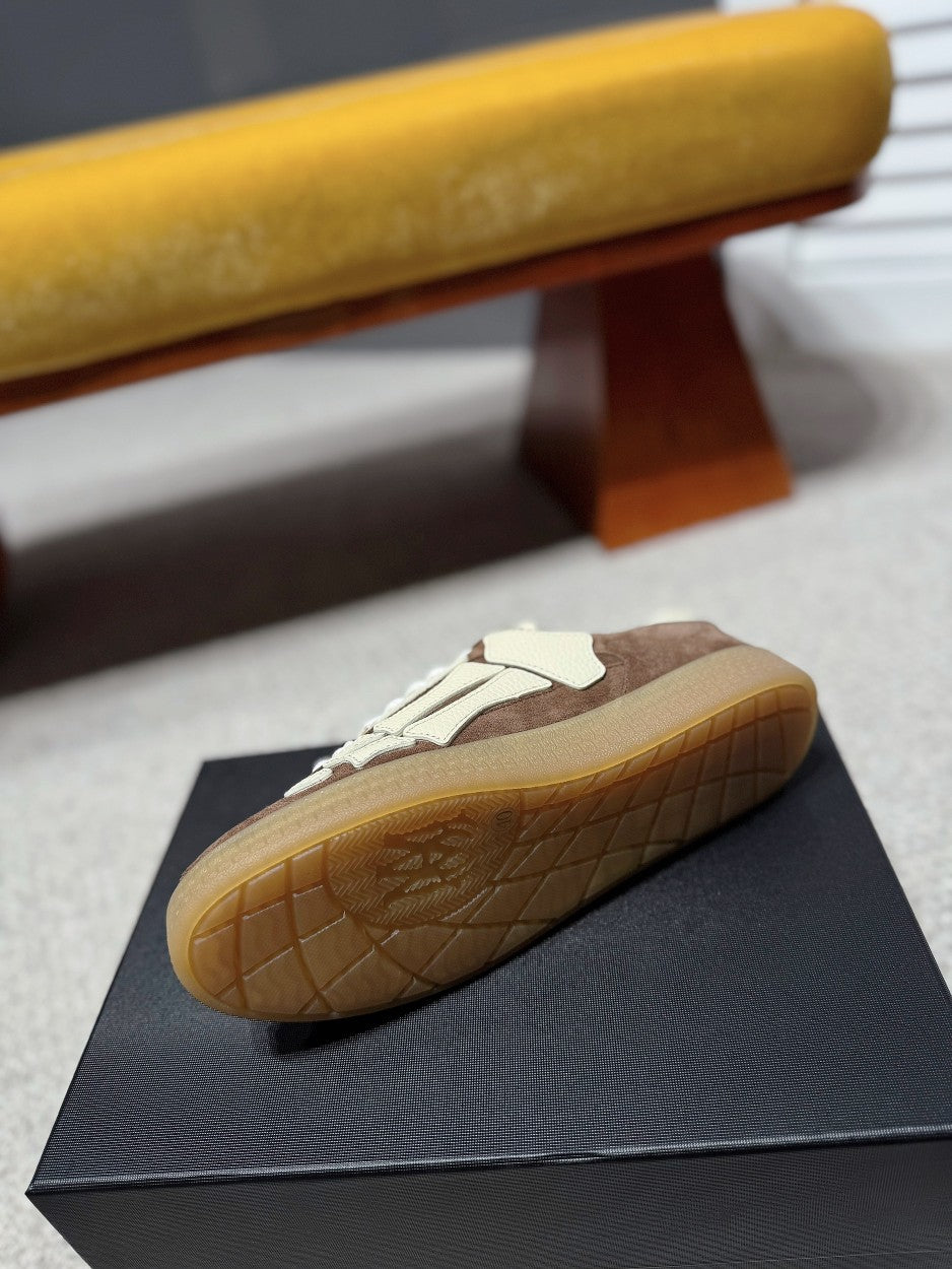 Suede sneakers, brown and cream, side view with white laces and gum sole