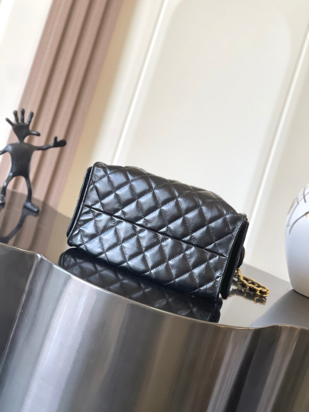 Chanel quilted black leather flap bag with gold chain shoulder strap