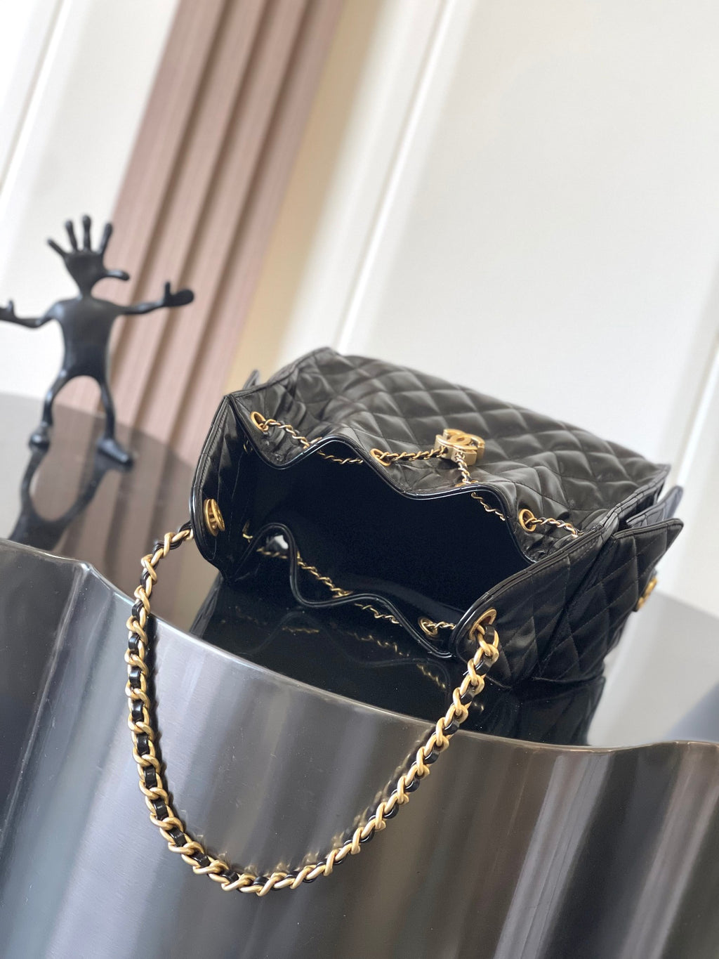 Chanel quilted black leather mini bag with gold chain strap