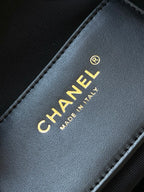 Chanel gold 'CHANEL' text on black leather 'MADE IN ITALY' label