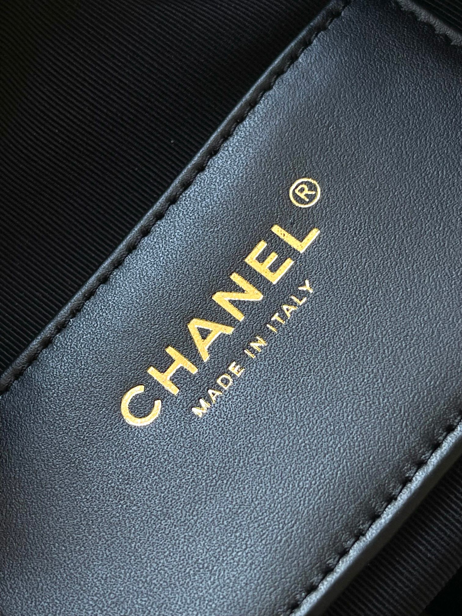 Chanel gold 'CHANEL' text on black leather 'MADE IN ITALY' label