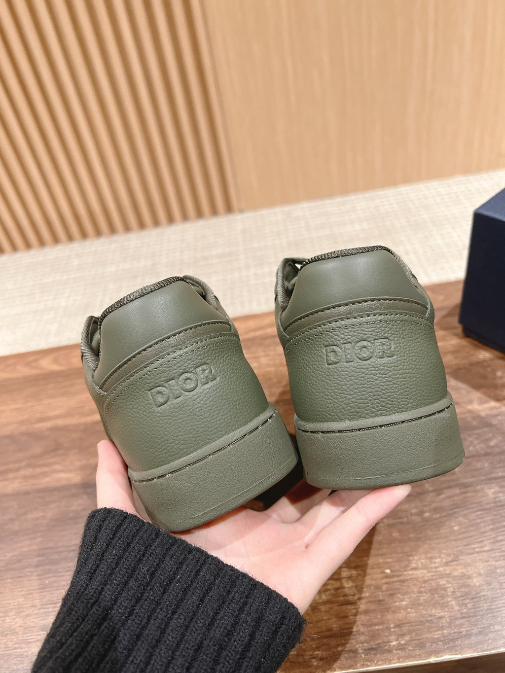 Dior unisex sneakers, olive green with heel tab showing Dior logo