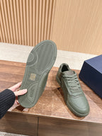 Dior unisex sneakers, olive green with treaded rubber outsole and lace-up upper