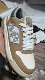 Amiri tan and white sneakers with white laces and side logo patch