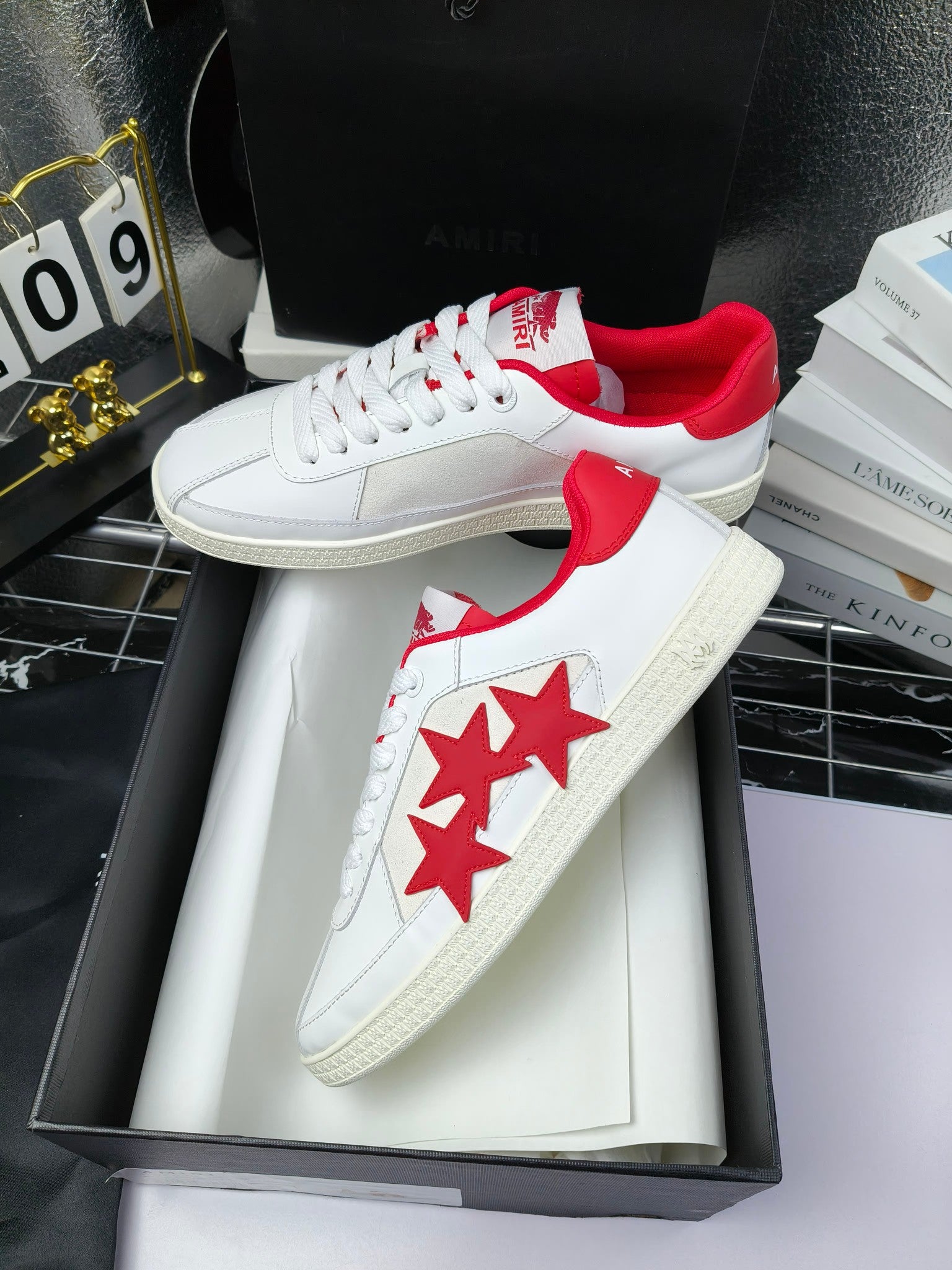 Low-top sneakers, white leather with red star graphics and red interior lining