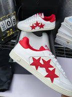 Low-top sneakers with red star side decals, white leather and textured off-white sole