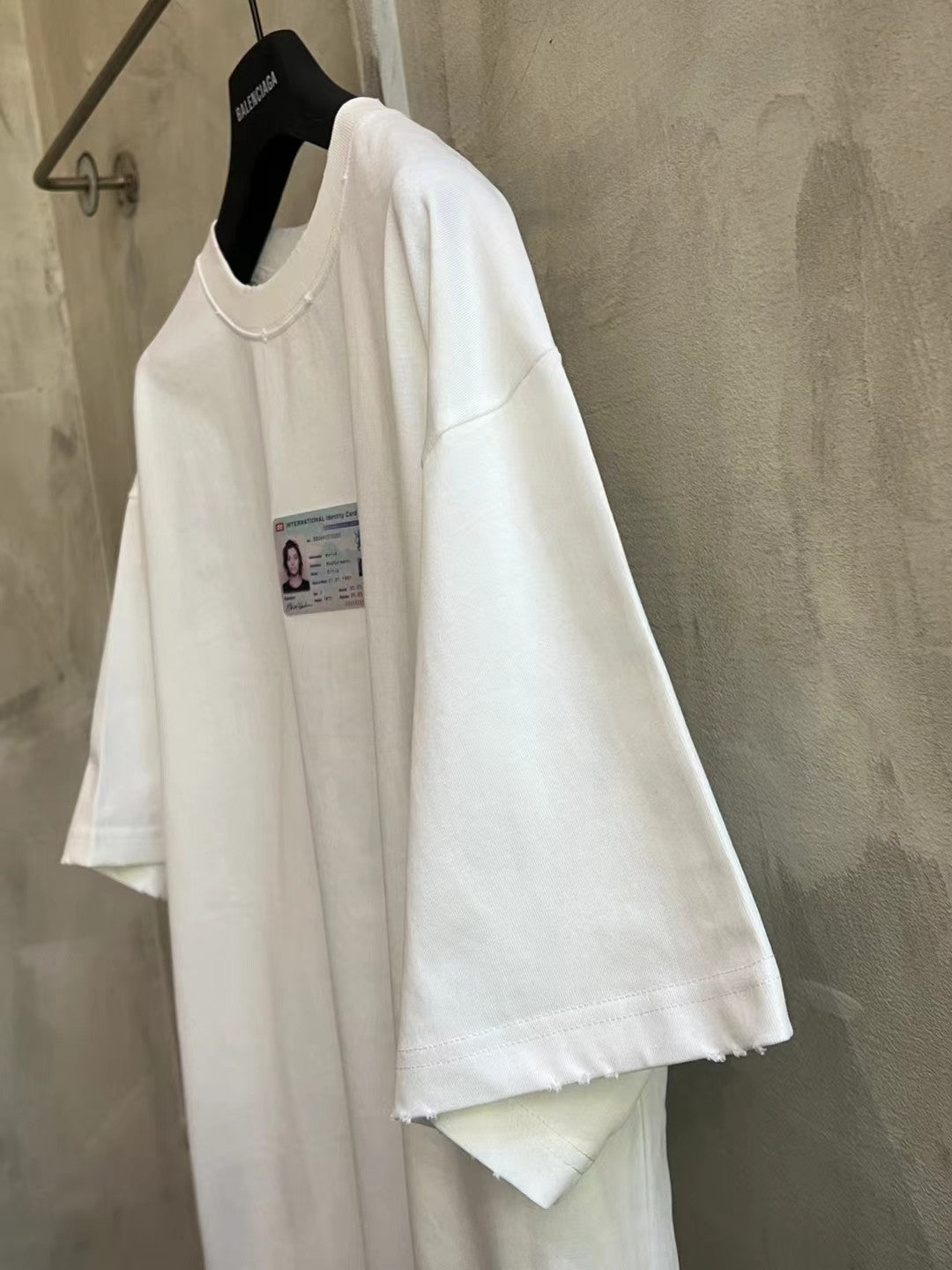 Balenciaga white short-sleeve T-shirt with ID card graphic, side view