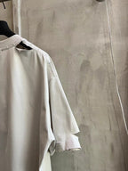 White short-sleeve T-shirt side view with crew neck and printed neckline