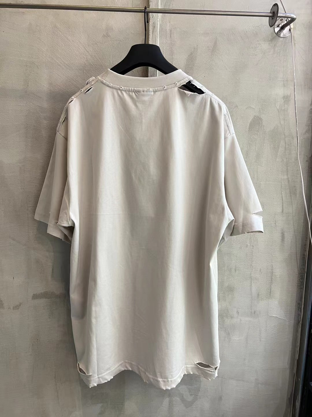 White short-sleeve T-shirt back view with crew neck and no visible front print