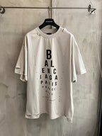 White Balenciaga graphic T-shirt with vertical logo text on the front