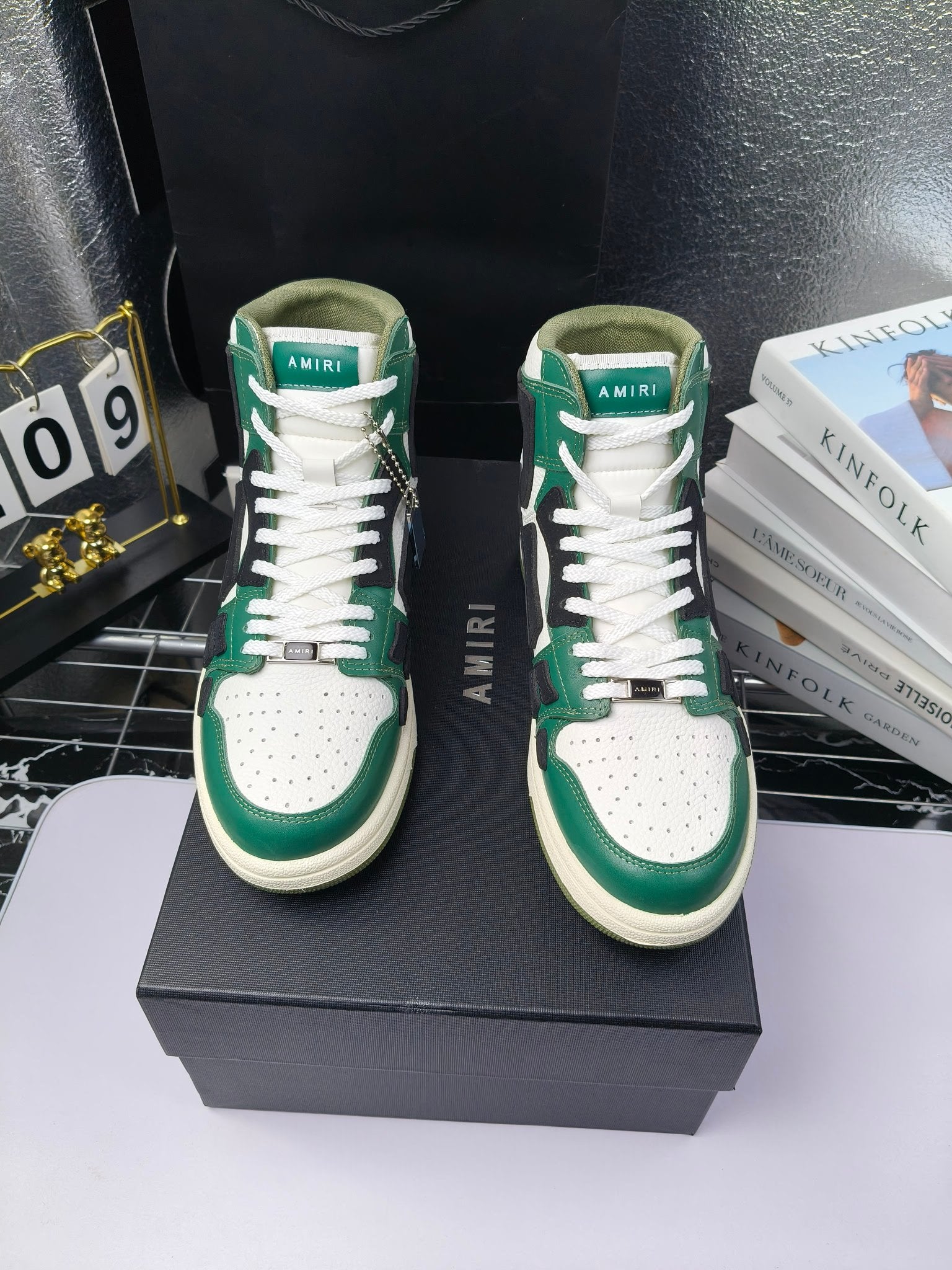 Green and white high-top sneakers with black accents and white laces, cream sole.