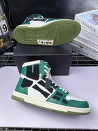 Green and white high-top sneaker with black accents; visible textured rubber outsole.