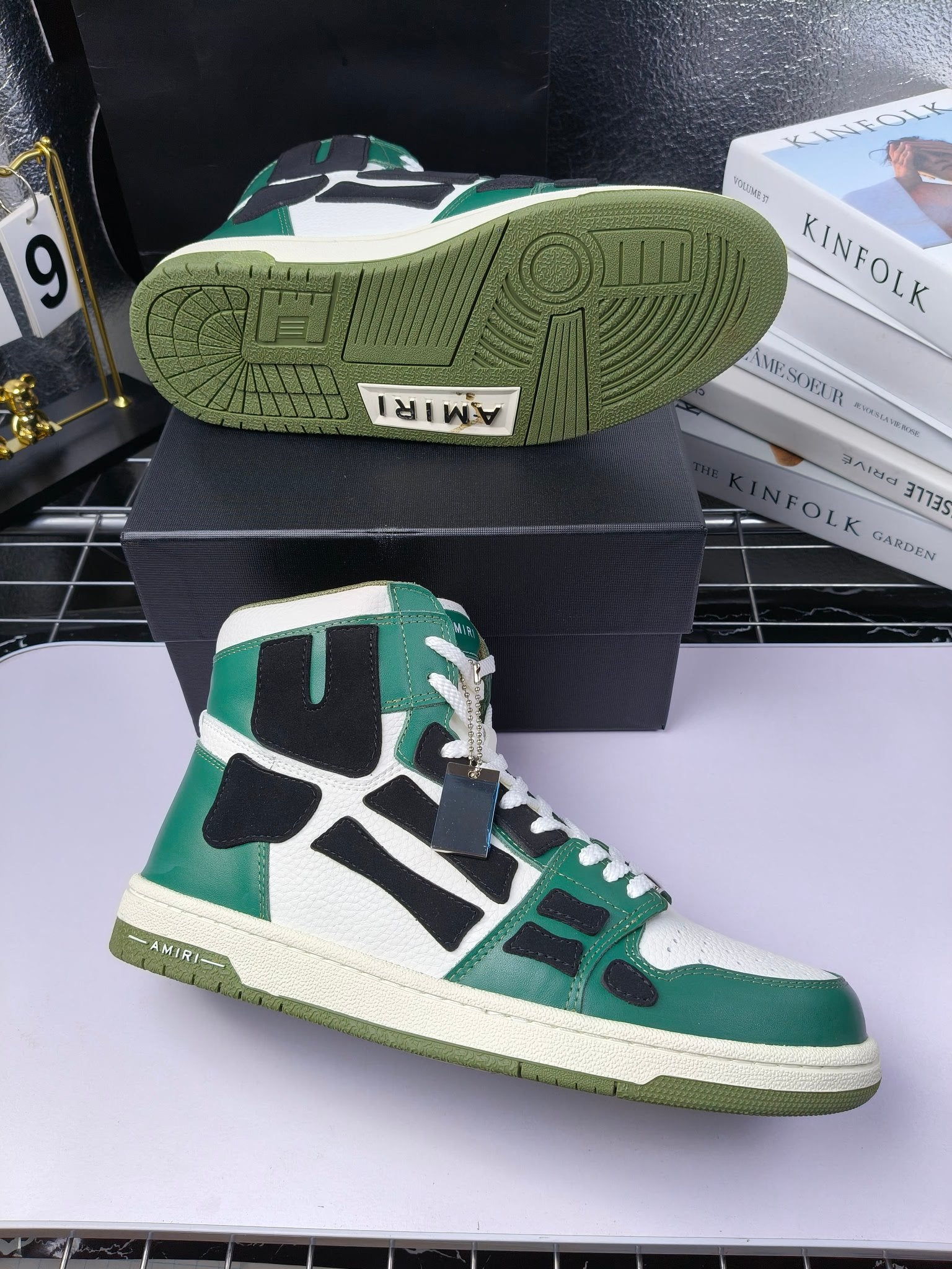 Green and white high-top sneaker with black accents; visible textured rubber outsole.