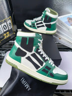 Green, white, and black high-top lace-up sneakers with textured cream sole.