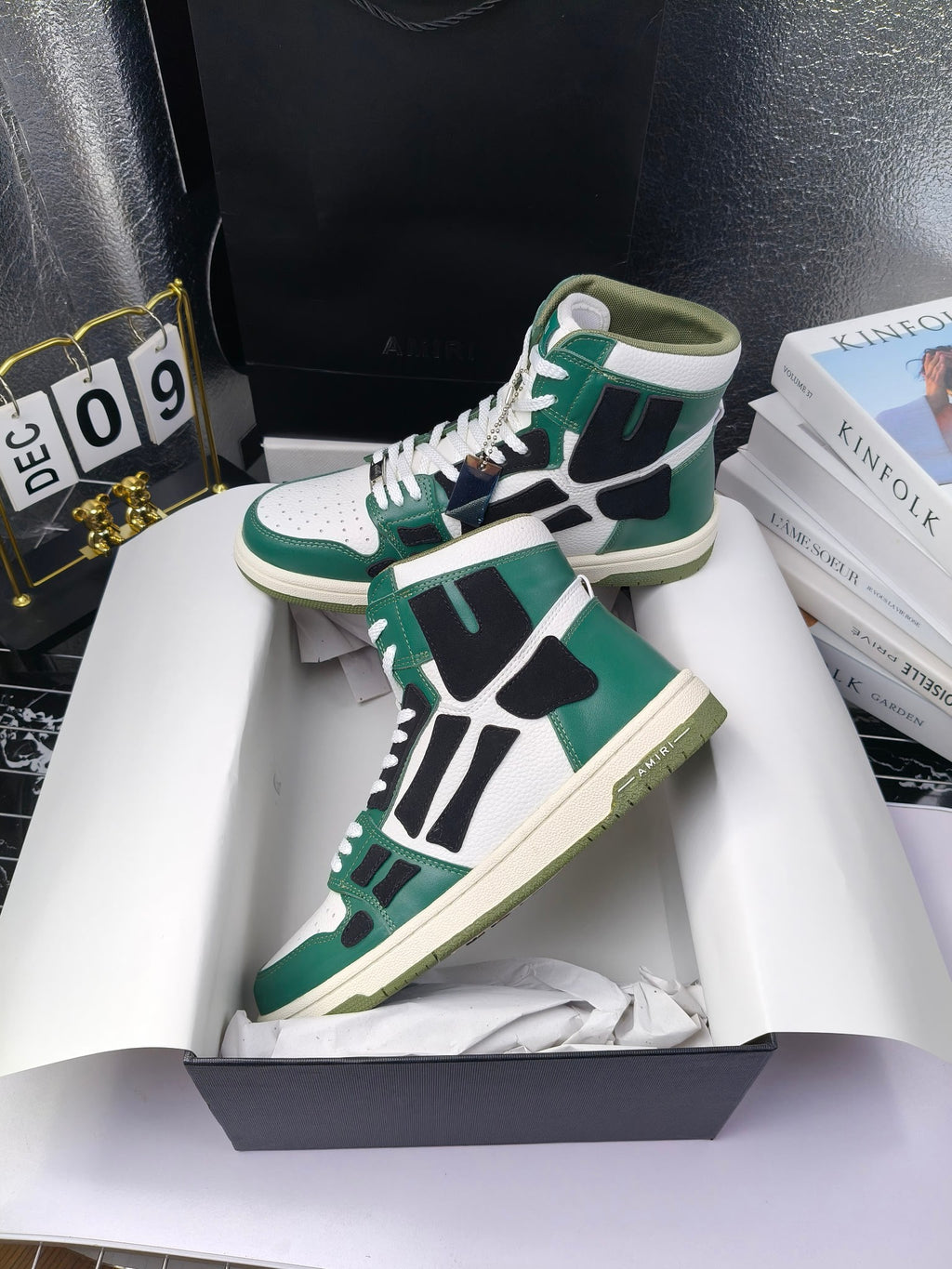 Green and white high-top lace-up sneakers with black panels and cream sole, angled view.