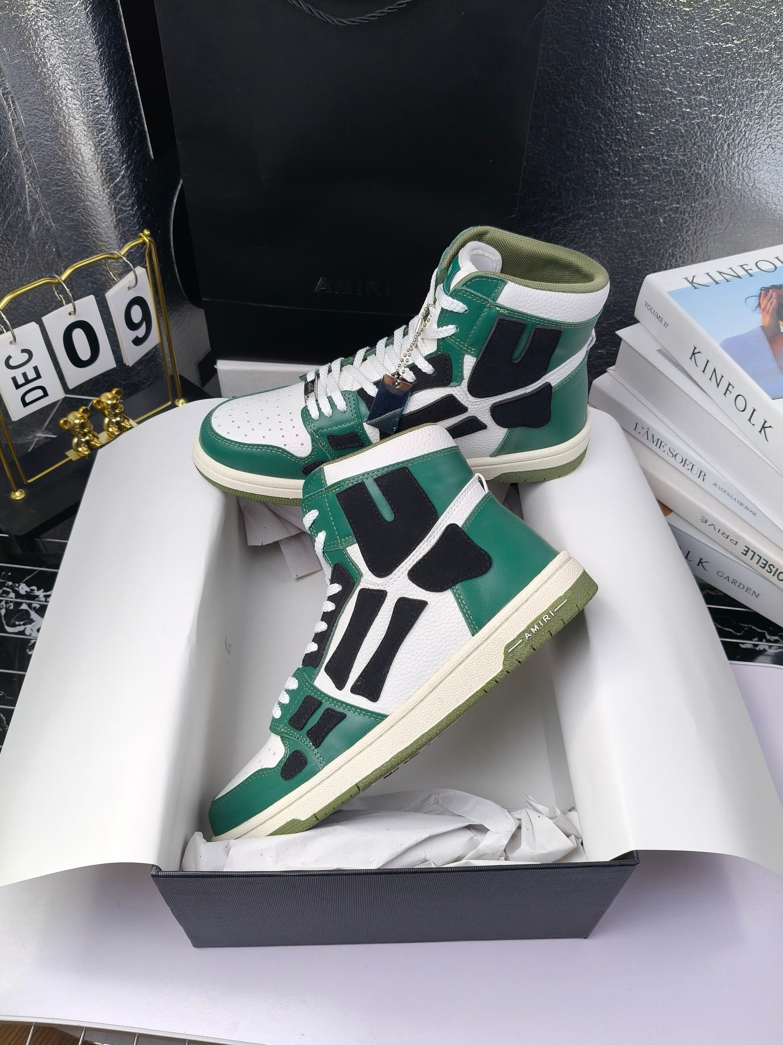 Green and white high-top lace-up sneakers with black panels and cream sole, angled view.