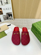 Gucci mule sandals in dark red, GG patterned fabric uppers with gold-tone buckle details