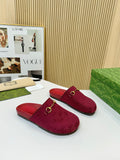 Gucci mule sandals in dark red fabric with GG pattern and gold-tone buckle hardware