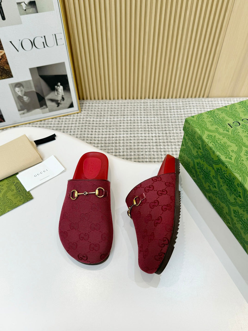 Gucci red mule sandals with GG logo texture and gold-tone horsebit-style buckle trim