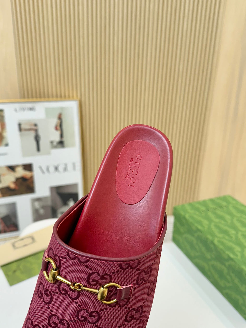 Gucci dark red mule sandal with interior view and GG-patterned strap with gold buckle