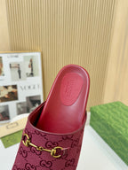 Gucci dark red mule sandal with interior view and GG-patterned strap with gold buckle
