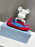 Prada unisex sneakers with red suede upper and blue swoosh, black lace trim