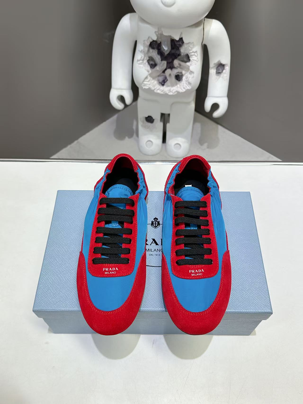 Prada unisex sneakers, red and blue colorblock, black laces, on display box