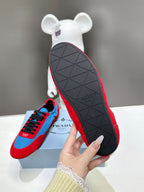 Prada unisex sneakers outsole view, red tread with geometric pattern