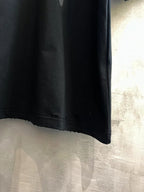 Black Balenciaga graphic T-shirt hem detail, short sleeves