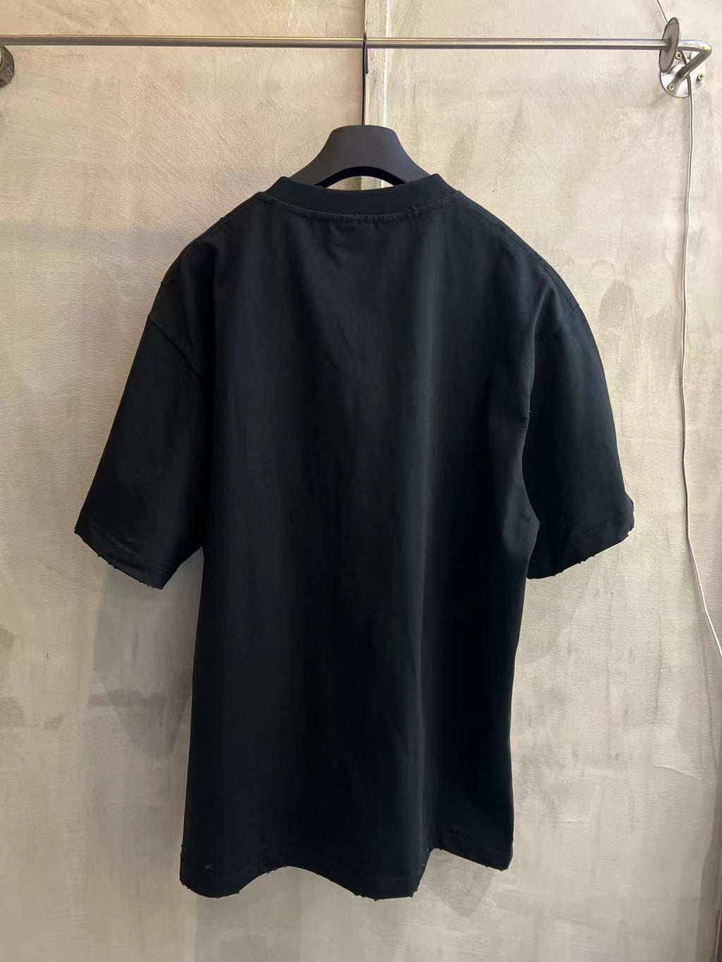 Black Balenciaga graphic T-shirt, back view, short sleeves